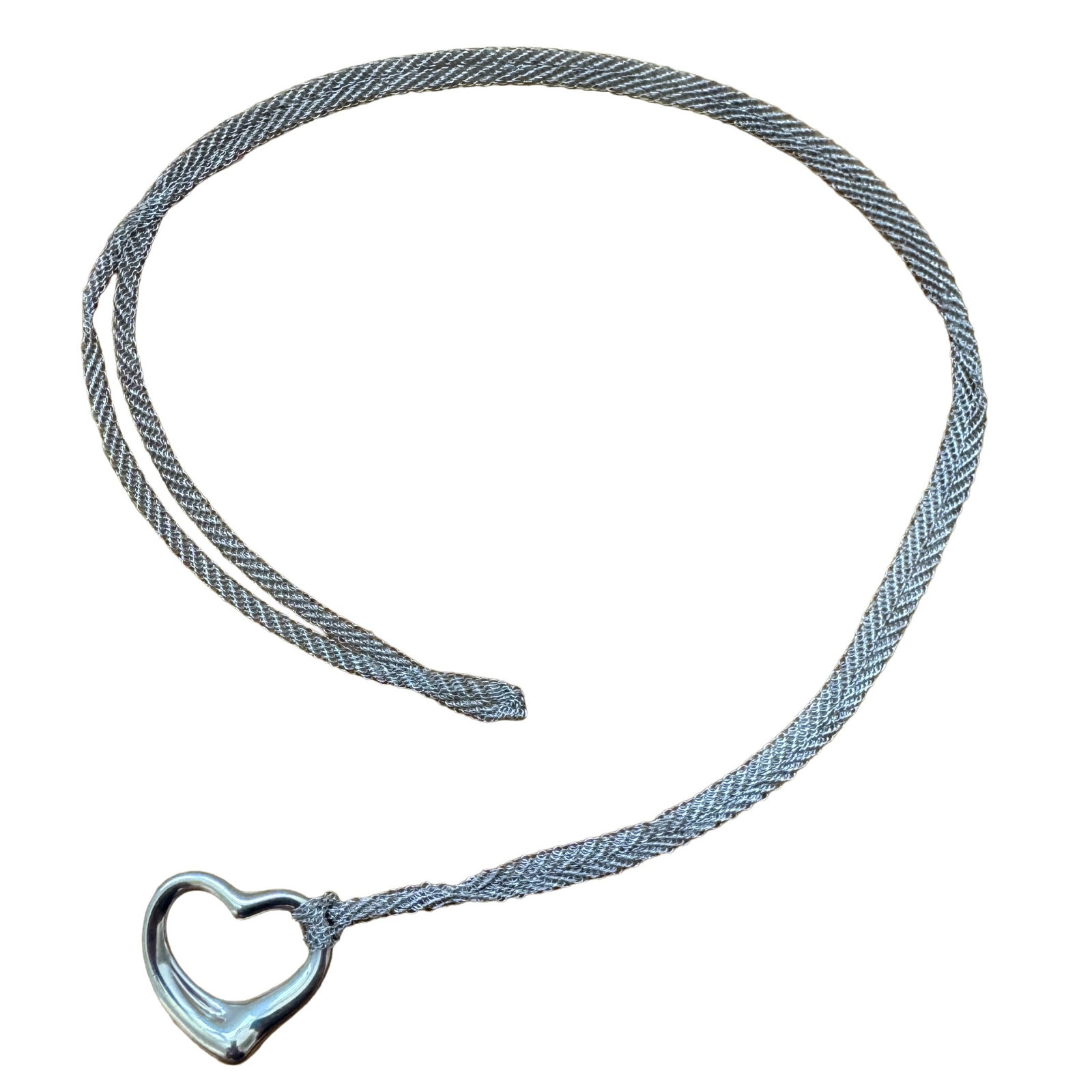Tiffany & Co. Elsa Peretti Open Heart Multi-Row Mesh Long Necklace: Tiffany & Co. Elsa Peretti Multi-Row Mesh Long Necklace with Heart Pendant Description: An elegant and fluid design by Elsa Peretti for Tiffany & Co., this multi-row mesh long necklace is paired with 