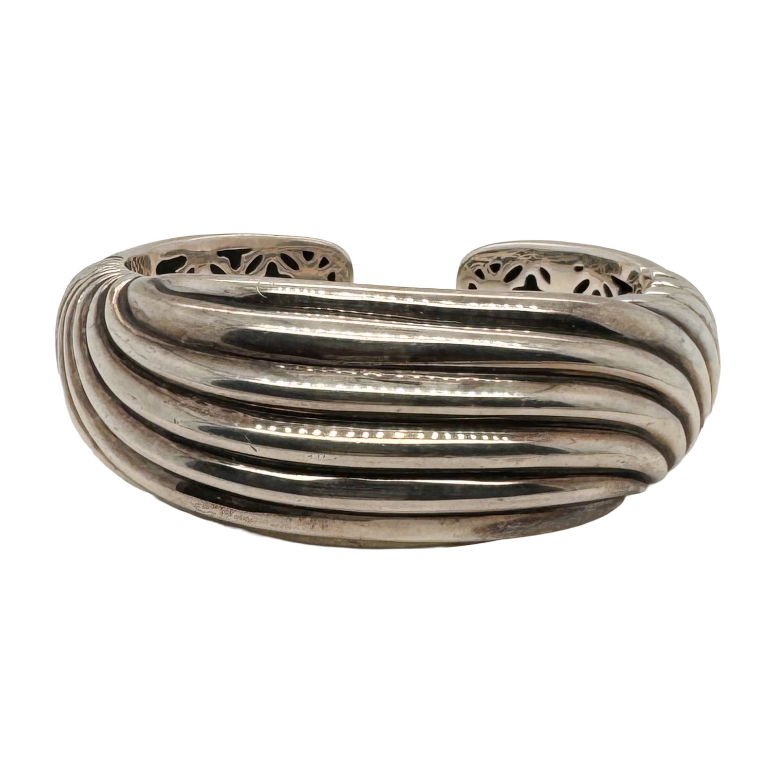 David Yurman Sterling Silver Sculptural Hinged Cuff Bracelet: David Yurman Sterling Silver Sculptural Hinged Cuff Bracelet Description: A bold and sculptural sterling silver cuff bracelet by David Yurman, showcasing the designer’s signature blend of modern for