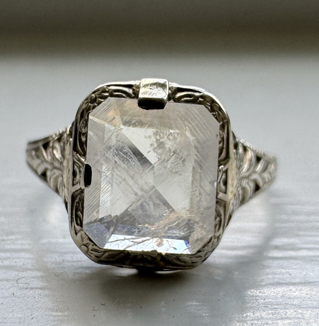 14K Gold Art Deco Filigree Upcycled Ring with Emerald Cut Moonstone: 14K Gold Art Deco Filigree Upcycled Ring with Emerald Cut Moonstone Metal: 14K Gold Style: Art Deco Filigree Upcycled Ring Ring Size: 5.5 Total Weight: 1.3 grams<