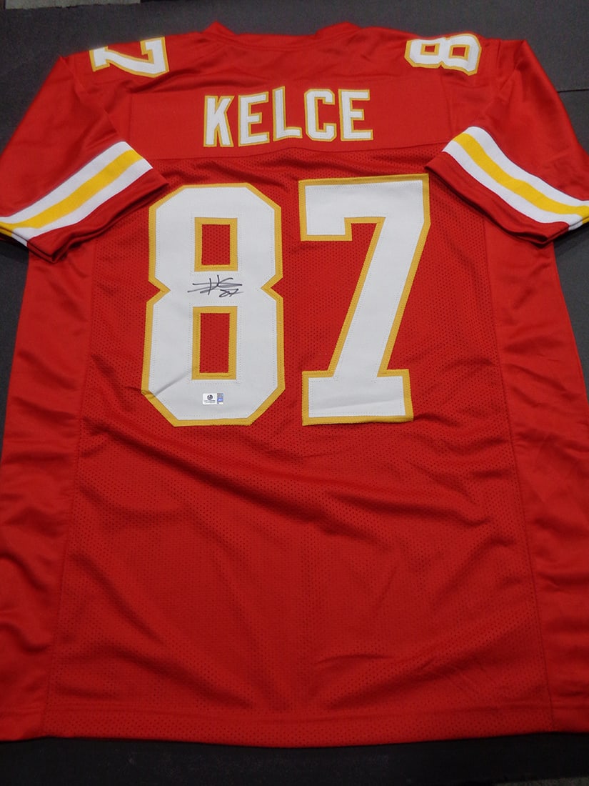 Travis Kelce Kansas City Chiefs Autographed Custom Football Jersey coa: Travis Kelce Kansas City Chiefs Autographed Custom Football Jersey GA coa - Autograph Location & coa # may vary JERSEY SIZE EXTRA LARGE - CUSTOM JERSEY MEANS NO LOGOS, NO TEAM NAMES, & NO BRAND NAMES