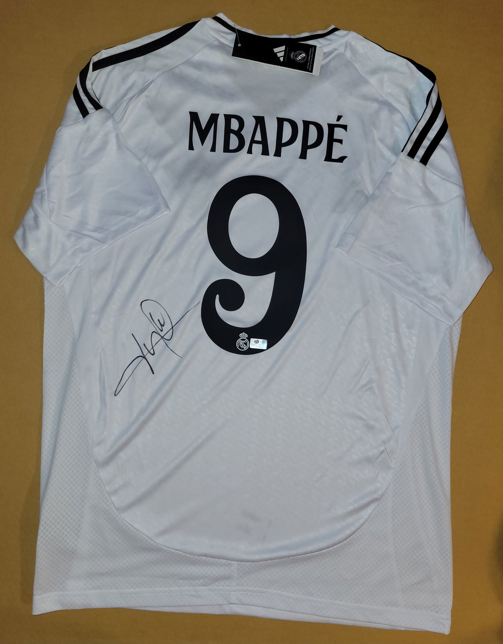 Kylian Mbappe Real Madrid Autographed 2024-25 Adidas Home Jersey coa: Kylian Mbappé Real Madrid Autographed 2024-25 Adidas Home Jersey GA coa - Autograph Location & coa # may vary JERSEY SIZE EXTRA LARGE
