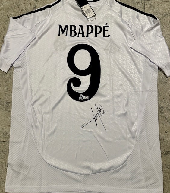 Kylian Mbappe Real Madrid Autographed 2024-25 Adidas Home Jersey coa: Kylian Mbappé Real Madrid Autographed 2024-25 Adidas Home Jersey GA coa - Autograph Location & coa # may vary JERSEY SIZE EXTRA LARGE