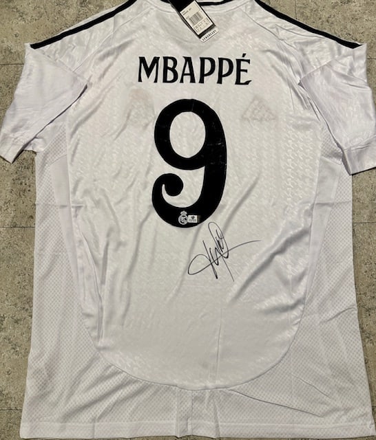 Kylian Mbappé Real Madrid Autographed 2024-25 Adidas Home Jersey coa: Kylian Mbappé Real Madrid Autographed 2024-25 Adidas Home Jersey GA coa - Autograph Location & coa # may vary JERSEY SIZE EXTRA LARGE