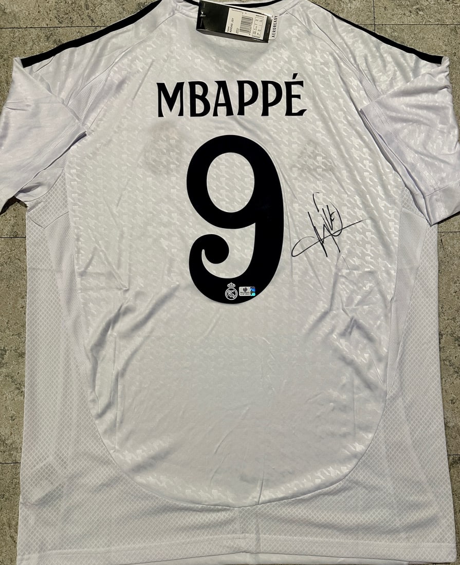 Kylian Mbappé Real Madrid Autographed 2024-25 Adidas Home Jersey coa: Kylian Mbappé Real Madrid Autographed 2024-25 Adidas Home Jersey GA coa - Autograph Location & coa # may vary JERSEY SIZE EXTRA LARGE 