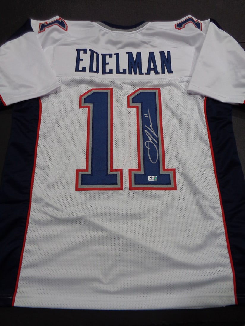 Autographed Julian Edelman Patriots Custom Football Jersey COA: Autographed Julian Edelman Patriots Custom Football Jersey GA COA ----- Autograph Location and coa number may vary JERSEY SIZE EXTRA LARGE - CUSTOM JERSEY MEANS NO LOGOS, NO TEAM NAMES, & NO BRAND
