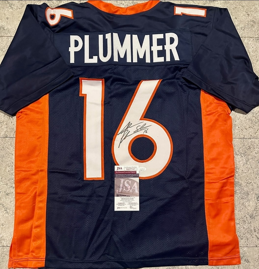Autographed Jake Plummer Broncos Custom Football Jersey JSA COA: Autographed Jake Plummer Broncos Custom Football Jersey JSA COA ----- Autograph Location and coa number may vary JERSEY SIZE EXTRA LARGE - CUSTOM JERSEY MEANS NO LOGOS, NO TEAM NAMES, & NO BRAND