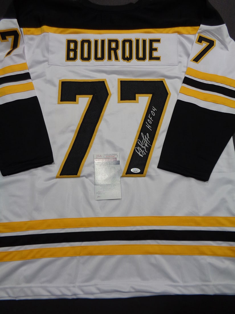 Autographed & Inscribed Ray Bourque Bruins Custom Hockey Jersey JSA COA: Autographed & Inscribed "HOF 04" Ray Bourque Boston Bruins Custom Hockey Jersey JSA COA ----- Autograph Location and coa number may vary JERSEY SIZE EXTRA LARGE - CUSTOM JERSEY MEANS NO LOGOS, NO