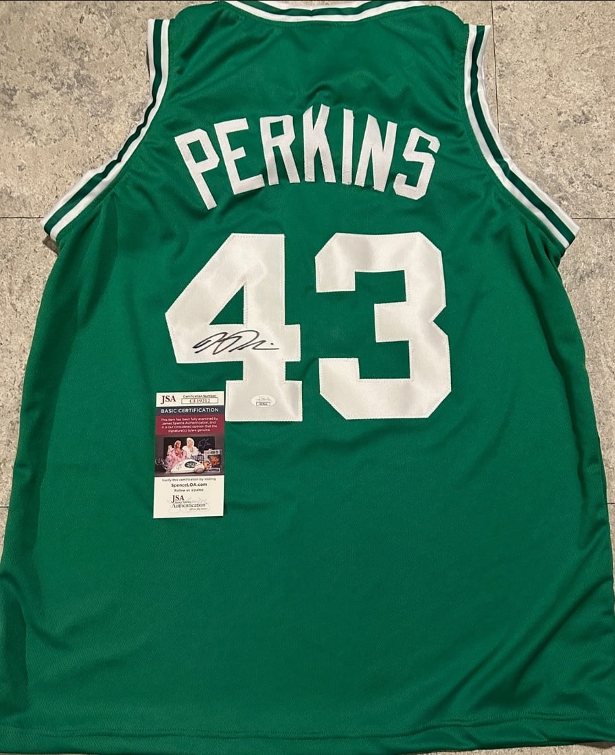 Autographed Kendrick Perkins Boston Celtics Custom Basketball Jersey JSA COA: Autographed Kendrick Perkins Boston Celtics Custom Basketball Jersey JSA COA ----- Autograph Location and coa number may vary JERSEY SIZE EXTRA LARGE - CUSTOM JERSEY MEANS NO LOGOS, NO TEAM NAMES, &