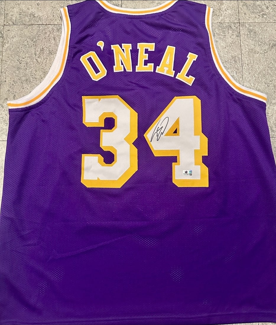 Shaquille O'Neal LA Lakers Autographed Custom Basketball Jersey coa: Shaquille O'Neal LA Lakers Autographed Custom Basketball Jersey GA coa - Autograph Location & coa # may vary JERSEY SIZE EXTRA LARGE - CUSTOM JERSEY MEANS NO LOGOS, NO TEAM NAMES, & NO BRAND NAMES 