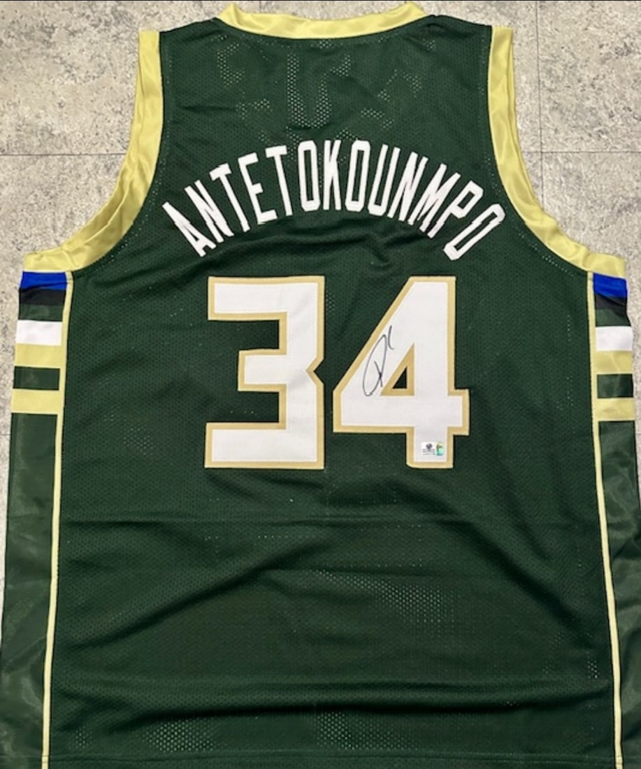 Giannis Antetokounmpo Milwaukee Bucks Autographed Custom Basketball Jersey coa: Giannis Antetokounmpo Milwaukee Bucks Autographed Custom Basketball Jersey GA coa - Autograph Location & coa # may vary JERSEY SIZE EXTRA LARGE - CUSTOM JERSEY MEANS NO LOGOS, NO TEAM NAMES, & NO BRAN