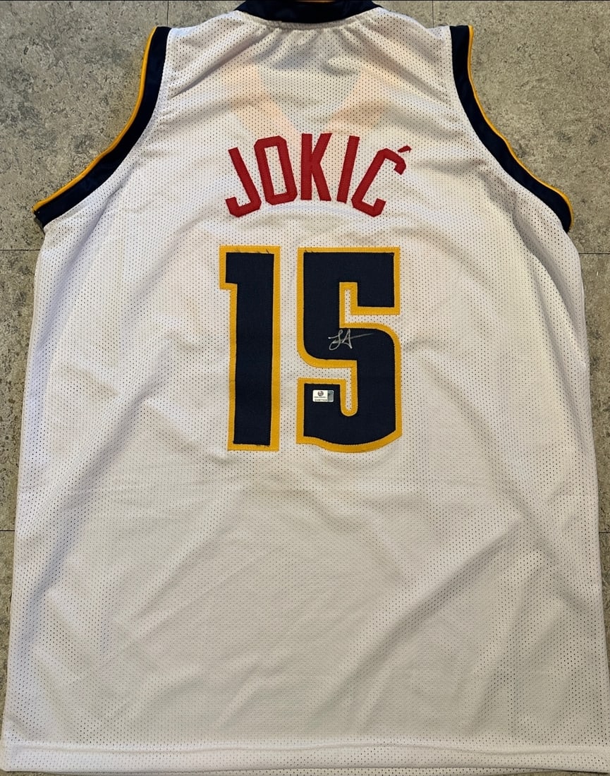 Nikola Jokic Denver Nuggets Autographed Custom Basketball Jersey coa: Nikola Jokic Denver Nuggets Autographed Custom Basketball Jersey GA coa - Autograph Location & coa # may vary JERSEY SIZE EXTRA LARGE - CUSTOM JERSEY MEANS NO LOGOS, NO TEAM NAMES, & NO BRAND NAMES 