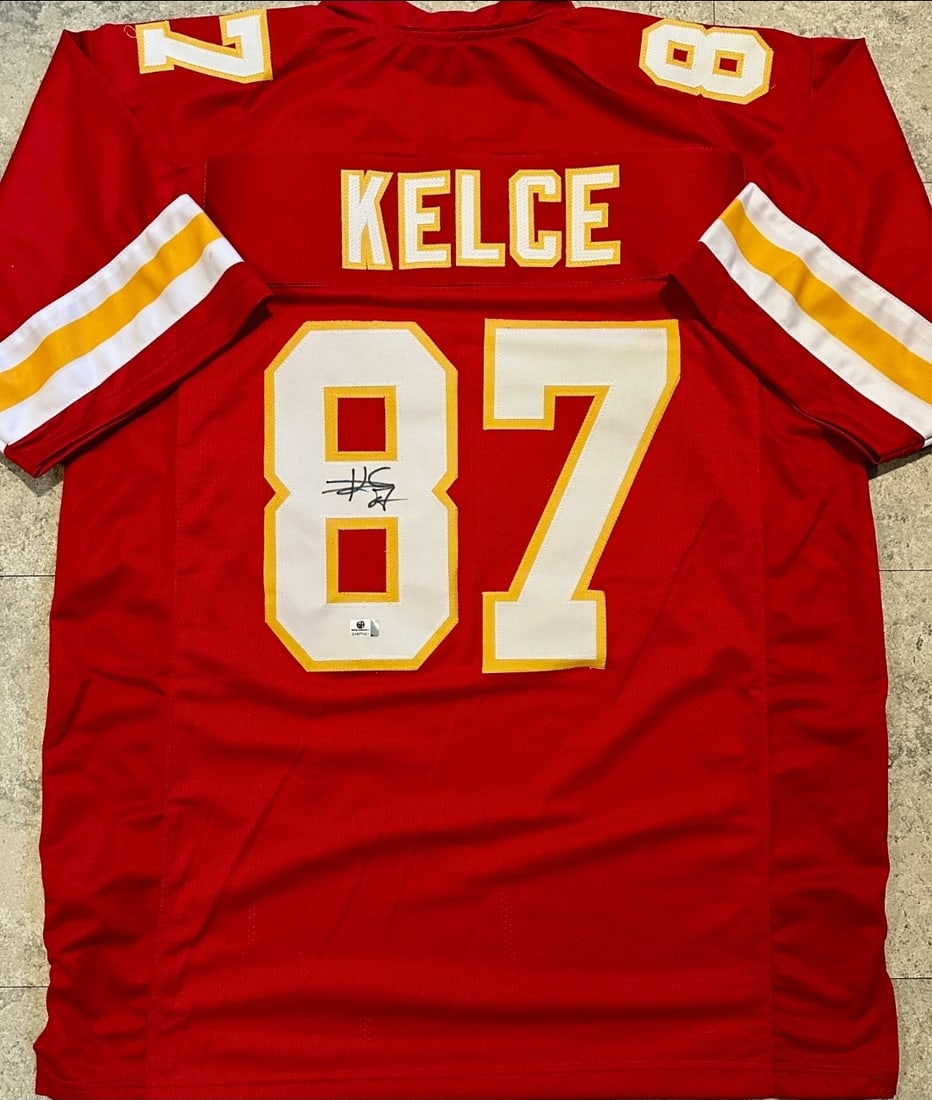 Travis Kelce Kansas City Chiefs Autographed Custom Football Jersey coa: Travis Kelce Kansas City Chiefs Autographed Custom Football Jersey GA coa - Autograph Location & coa # may vary JERSEY SIZE EXTRA LARGE - CUSTOM JERSEY MEANS NO LOGOS, NO TEAM NAMES, & NO BRAND