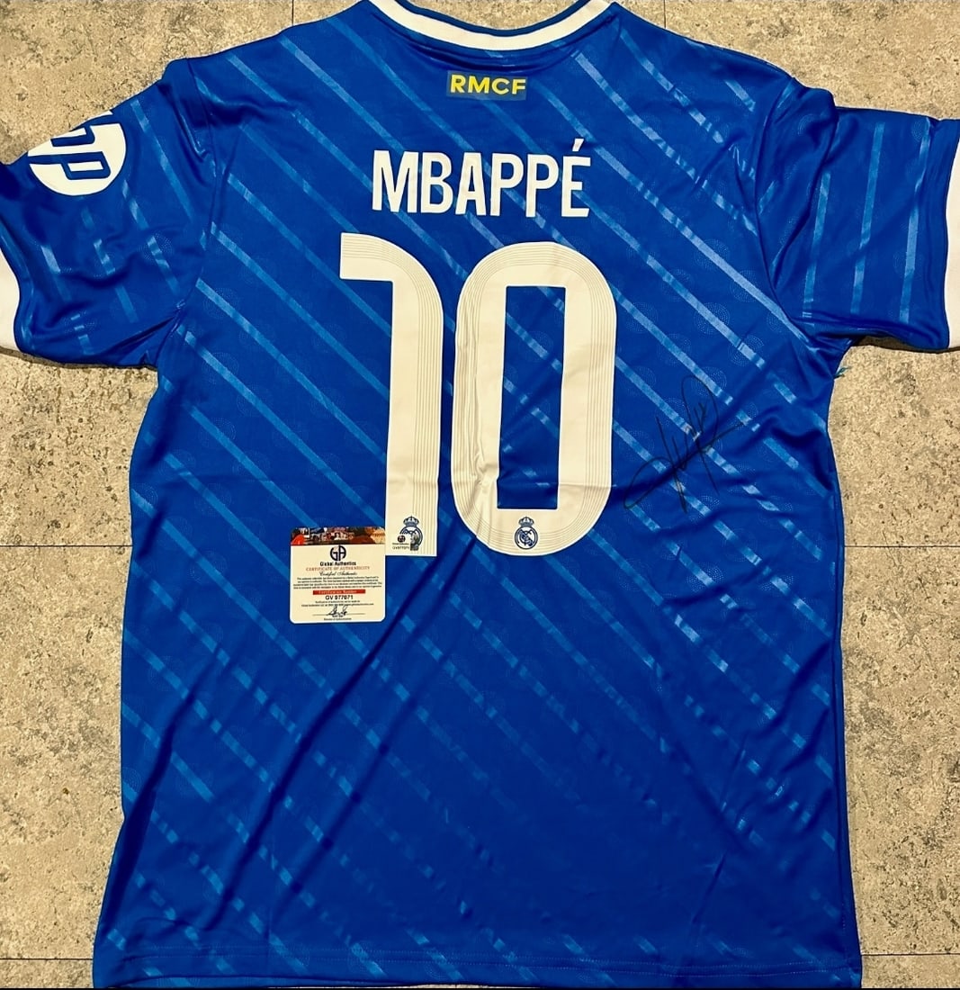 Kylian Mbappe Real Madrid Autographed 2025-26 Adidas 3rd Jersey coa: Kylian Mbappé Real Madrid Autographed 2025-26 Adidas 3rd Jersey GA coa - Autograph Location & coa # may vary JERSEY SIZE EXTRA LARGE 