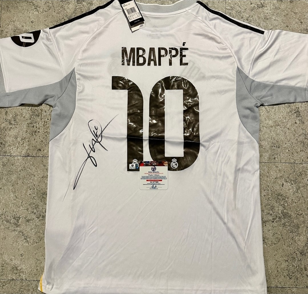 Kylian Mbappé Real Madrid Autographed 2025-26 Adidas Home Jersey coa: Kylian Mbappé Real Madrid Autographed 2025-26 Adidas Home Jersey GA coa - Autograph Location & coa # may vary JERSEY SIZE EXTRA LARGE