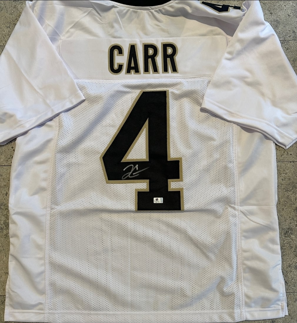 Derek Carr New Orleans Saints Autographed Custom Football Jersey coa: Derek Carr New Orleans Saints Autographed Custom Football Jersey GA coa - Autograph Location & coa # may vary JERSEY SIZE EXTRA LARGE - CUSTOM JERSEY MEANS NO LOGOS, NO TEAM NAMES, & NO BRAND NAMES