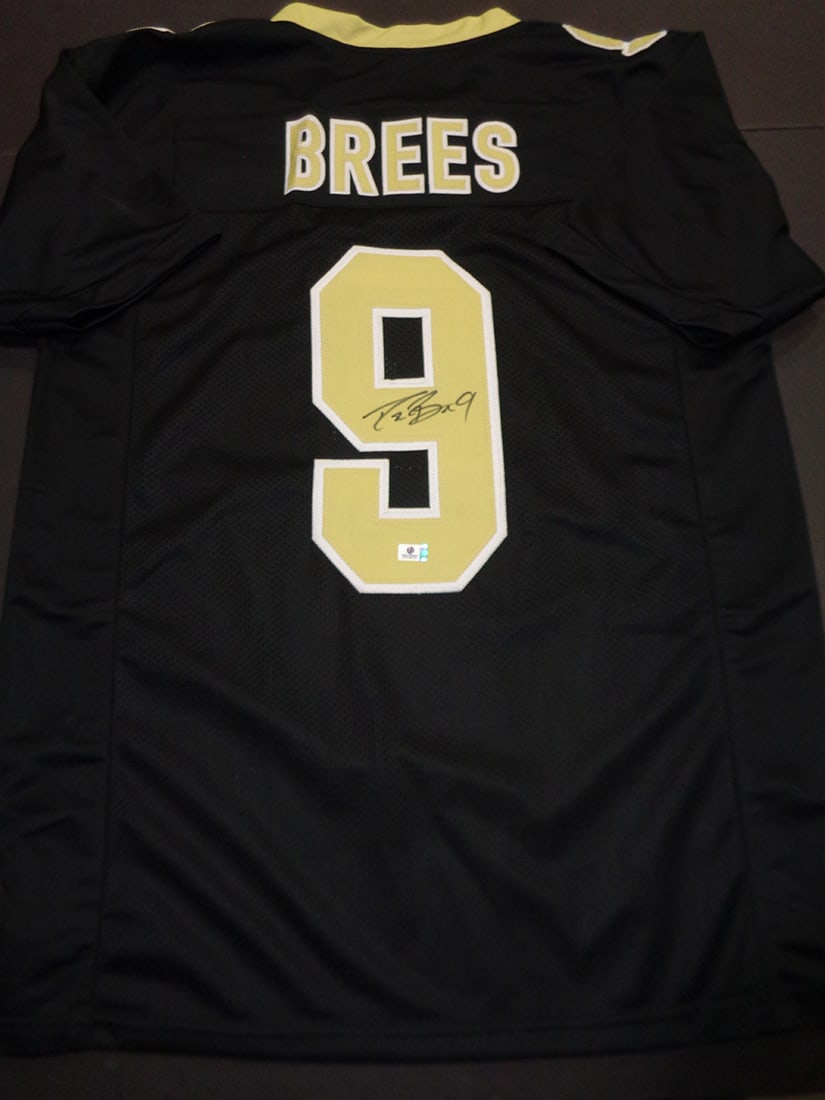 Drew Brees New Orleans Saints Autographed Custom Football Jersey coa: Drew Brees New Orleans Saints Autographed Custom Football Jersey GA coa - Autograph Location & coa # may vary JERSEY SIZE EXTRA LARGE - CUSTOM JERSEY MEANS NO LOGOS, NO TEAM NAMES, & NO BRAND NAMES