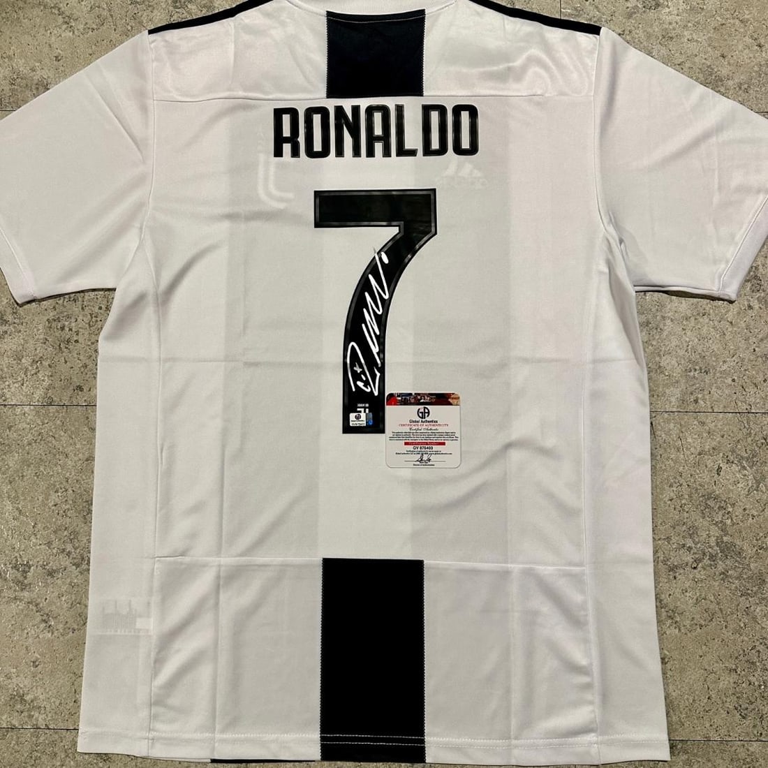 Cristiano Ronaldo FC Juventus Autographed Adidas 2018-19 Home Soccer Jersey coa: Cristiano Ronaldo FC Juventus Autographed Adidas 2018-19 Home Soccer Jersey GA coa - Autograph Location & coa # may vary JERSEY SIZE LARGE