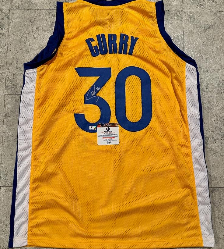Stephen Curry Golden State Warriors Autographed Custom Basketball Jersey coa: Stephen Curry Golden State Warriors Autographed Custom Basketball Jersey GA coa - Autograph Location & coa # may vary JERSEY SIZE EXTRA LARGE - CUSTOM JERSEY MEANS NO LOGOS, NO TEAM NAMES, & NO BRAND