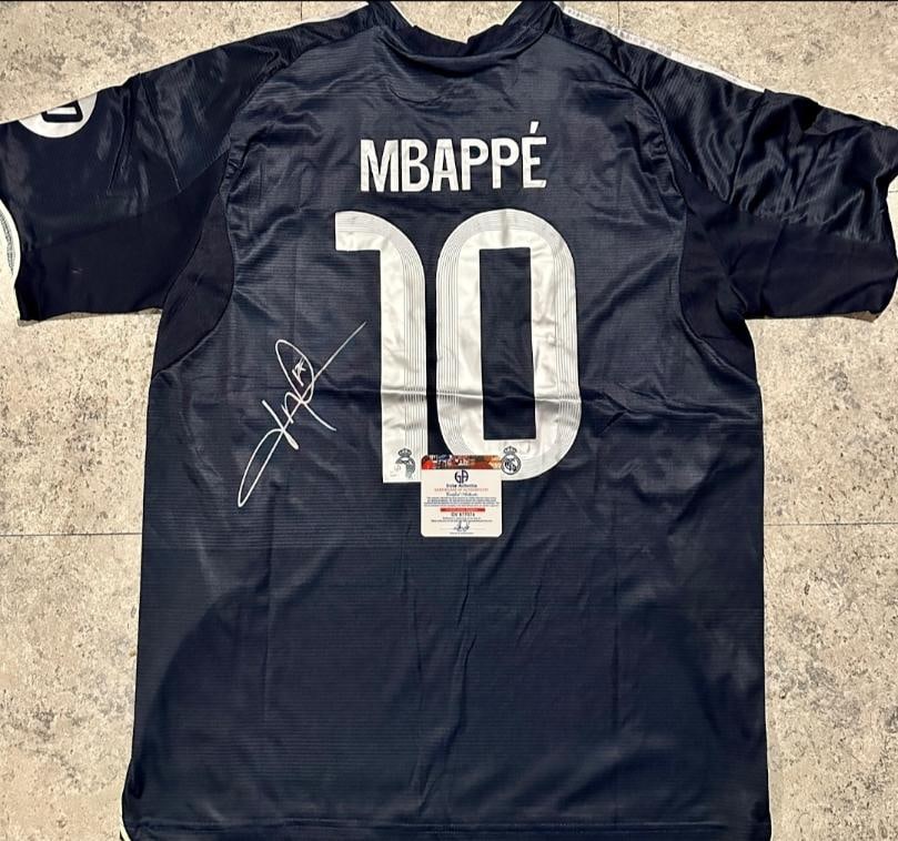 Kylian Mbappe Real Madrid Autographed 2025-26 Adidas Away Jersey coa: Kylian Mbappé Real Madrid Autographed 2025-26 Adidas Away Jersey GA coa - Autograph Location & coa # may vary JERSEY SIZE EXTRA LARGE
