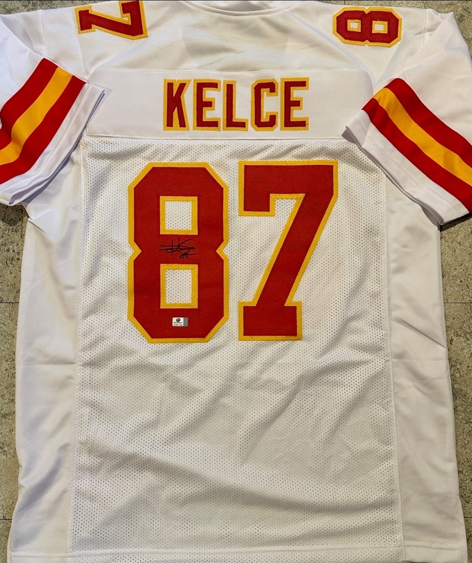 Travis Kelce Kansas City Chiefs Autographed Custom Football Jersey coa: Travis Kelce Kansas City Chiefs Autographed Custom Football Jersey GA coa - Autograph Location & coa # may vary JERSEY SIZE EXTRA LARGE - CUSTOM JERSEY MEANS NO LOGOS, NO TEAM NAMES, & NO BRAND NAMES