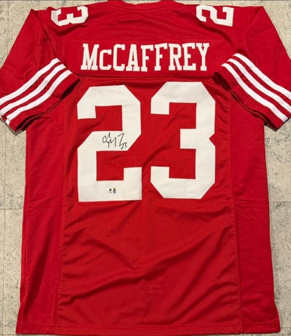 Christian McCaffery San Francisco 49ers Autographed Custom Football Jersey coa: Christian McCaffery San Francisco 49ers Autographed Custom Football Jersey GA coa - Autograph Location & coa # may vary JERSEY SIZE EXTRA LARGE - CUSTOM JERSEY MEANS NO LOGOS, NO TEAM NAMES, & NO