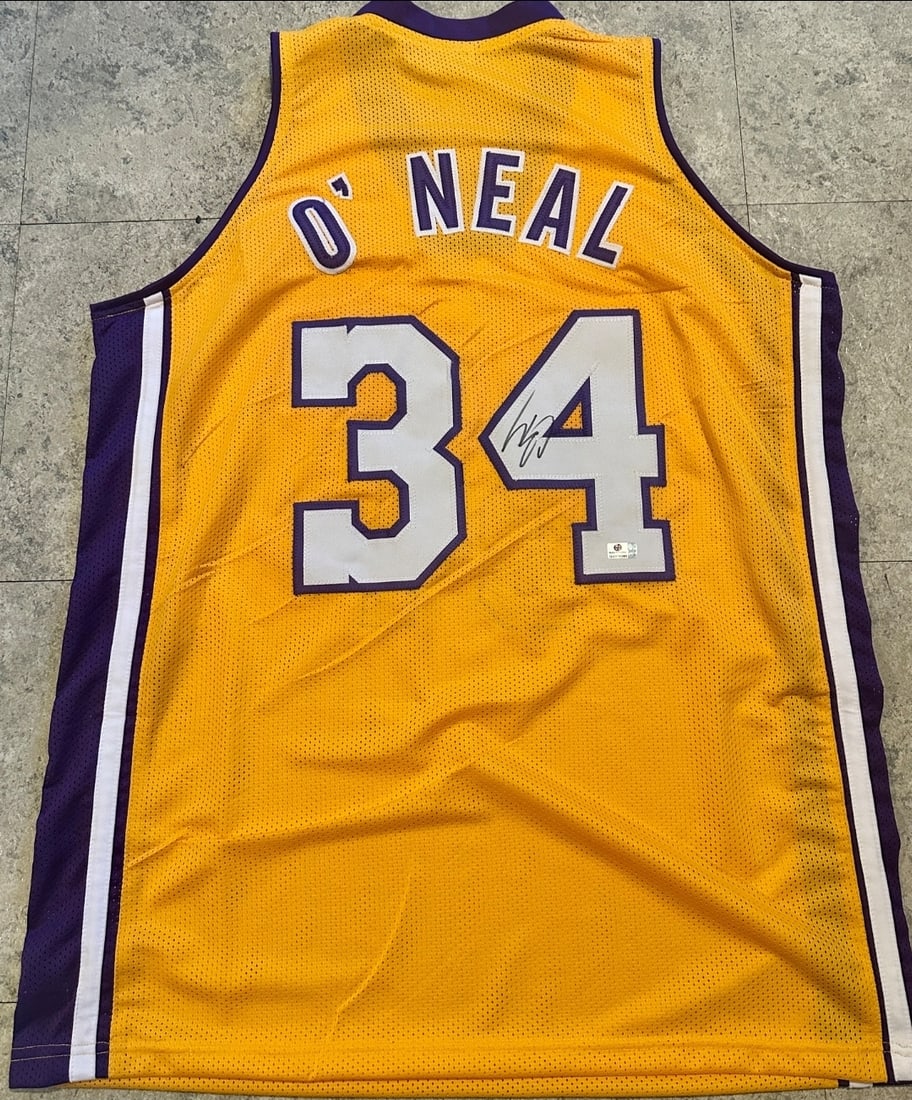 Shaquille O'Neal Los Angeles Lakers Autographed Custom Basketball Jersey coa: Shaquille O'Neal Los Angeles Lakers Autographed Custom Basketball Jersey GA coa - Autograph Location & coa # may vary JERSEY SIZE EXTRA LARGE - CUSTOM JERSEY MEANS NO LOGOS, NO TEAM NAMES, & NO BRAND