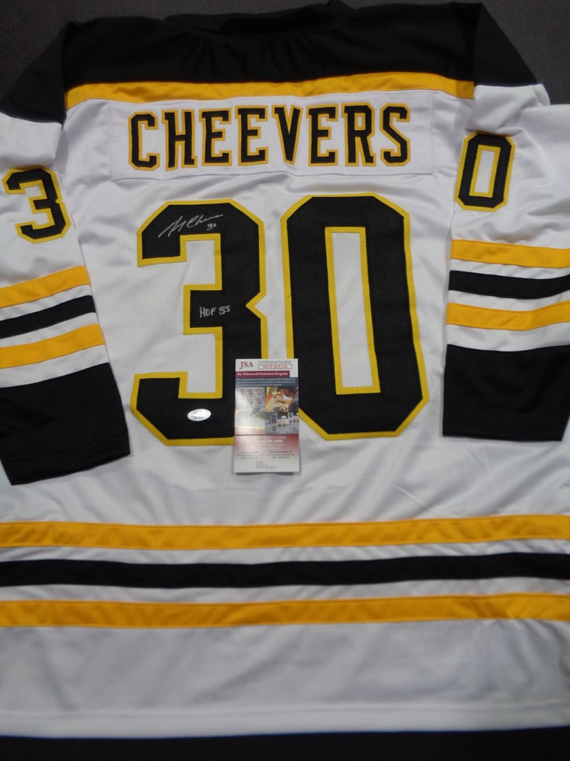 Gerry Cheevers Boston Bruins Autographed & Insc Custom Hockey Jersey JSA coa: Gerry Cheevers Boston Bruins Autographed & Inscribed "HOF 85" Custom Hockey Style Jersey w/JSA Witnessed coa - Autograph Location & coa # may vary JERSEY SIZE EXTRA LARGE - CUSTOM JERSEY MEANS NO LOGO