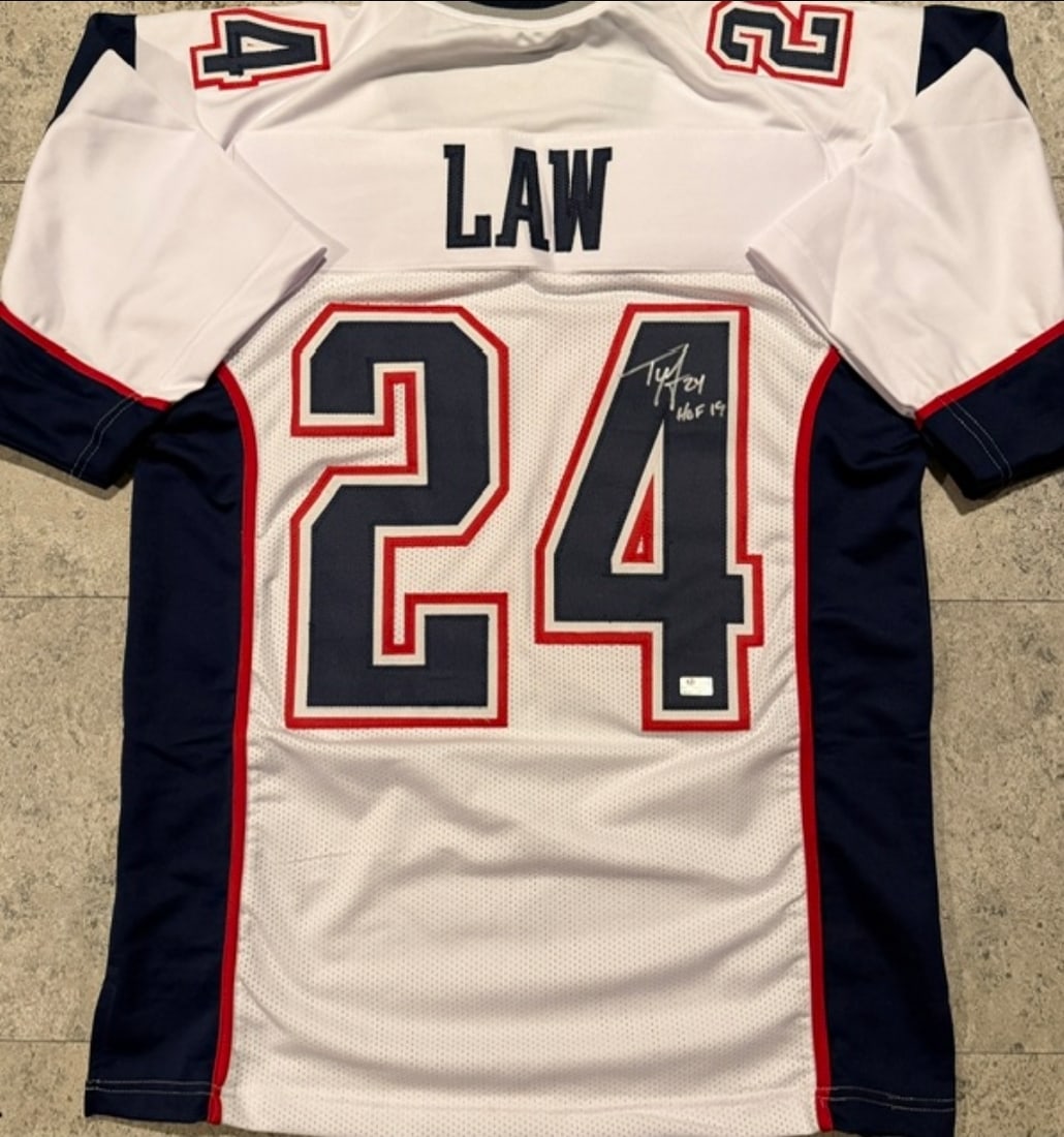 Ty Law New England Patriots Autographed & Inscribed Custom Football Jersey coa: Ty Law New England Patriots Autographed & Inscribed "HOF 19" Custom Football Jersey GA coa - Autograph Location & coa # may vary JERSEY SIZE EXTRA LARGE - CUSTOM JERSEY MEANS NO LOGOS, NO TEAM NAMES,