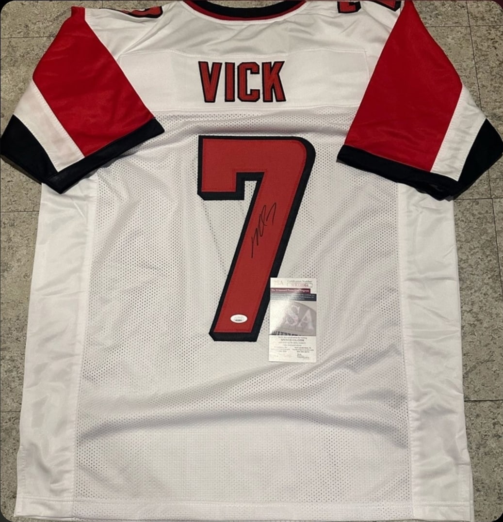 Michael Vick Atlanta Falcons Autographed Custom Football Jersey JSA coa: Michael Vick Atlanta Falcons Autographed Custom Football Style Jersey w/JSA Witnessed coa - Autograph Location & coa # may vary JERSEY SIZE EXTRA LARGE - CUSTOM JERSEY MEANS NO LOGOS, NO TEAM NAMES,
