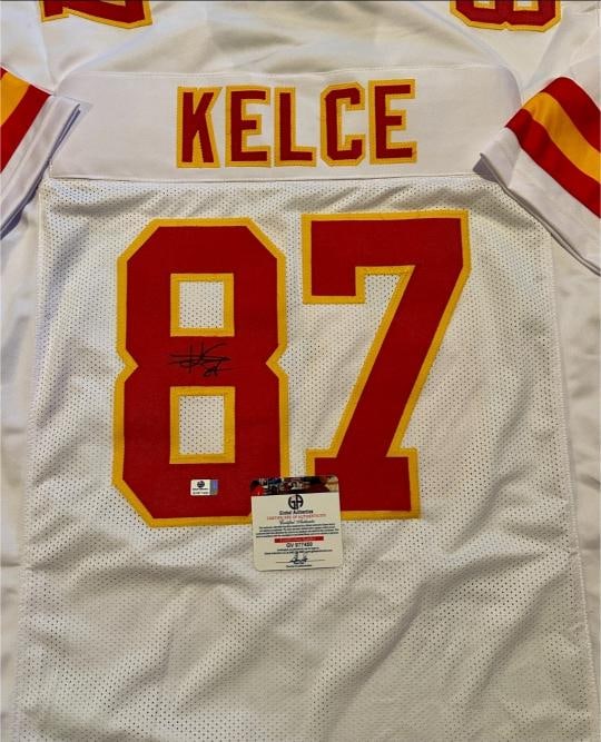 Travis Kelce Kansas City Chiefs Autographed Custom Football Jersey coa: Travis Kelce Kansas City Chiefs Autographed Custom Football Jersey GA coa - Autograph Location & coa # may vary JERSEY SIZE EXTRA LARGE - CUSTOM JERSEY MEANS NO LOGOS, NO TEAM NAMES, & NO BRAND NAMES