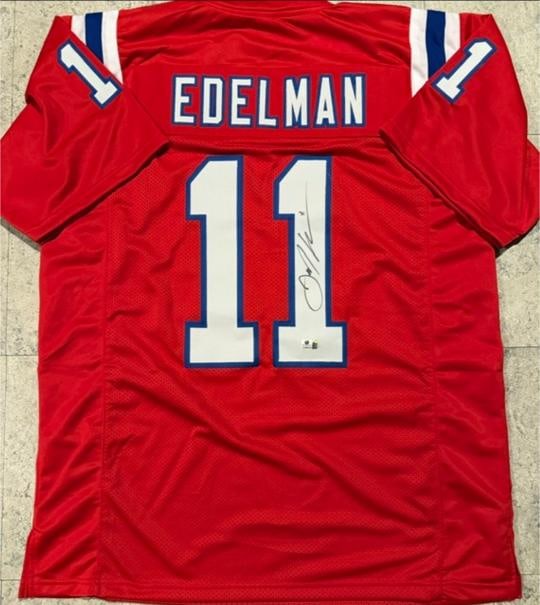 Julian Edelman New England Patriots Autographed Custom Football Jersey coa: Julian Edelman New England Patriots Autographed Custom Football Jersey GA coa - Autograph Location & coa # may vary JERSEY SIZE EXTRA LARGE - CUSTOM JERSEY MEANS NO LOGOS, NO TEAM NAMES, & NO BRAND