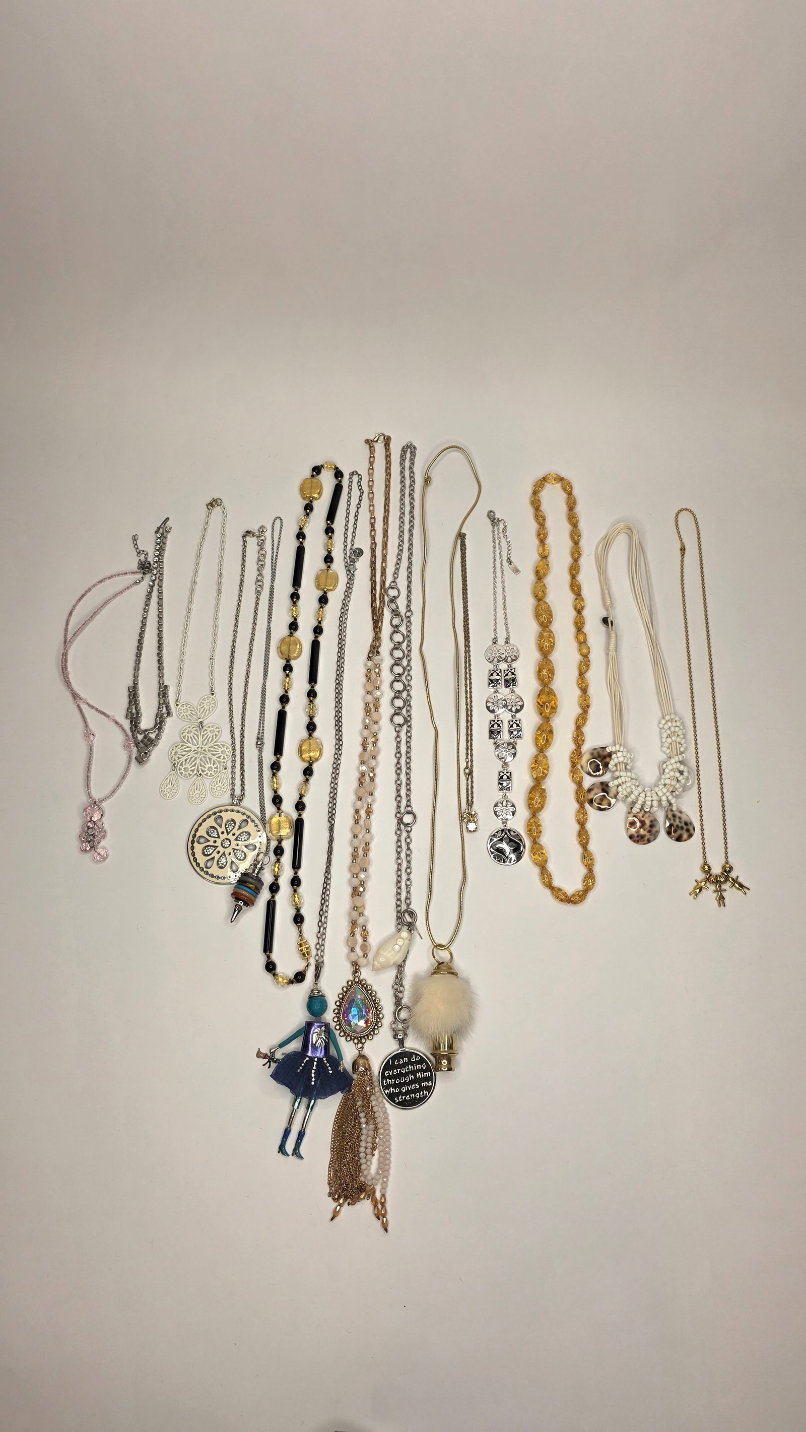 Costume Jewelry #1: Large mixed lot of fashion necklaces in various lengths, featuring metal, beaded, and novelty pendant designs. A fun and diverse collection ideal for resale or crafting. Dimensions 6x5x3