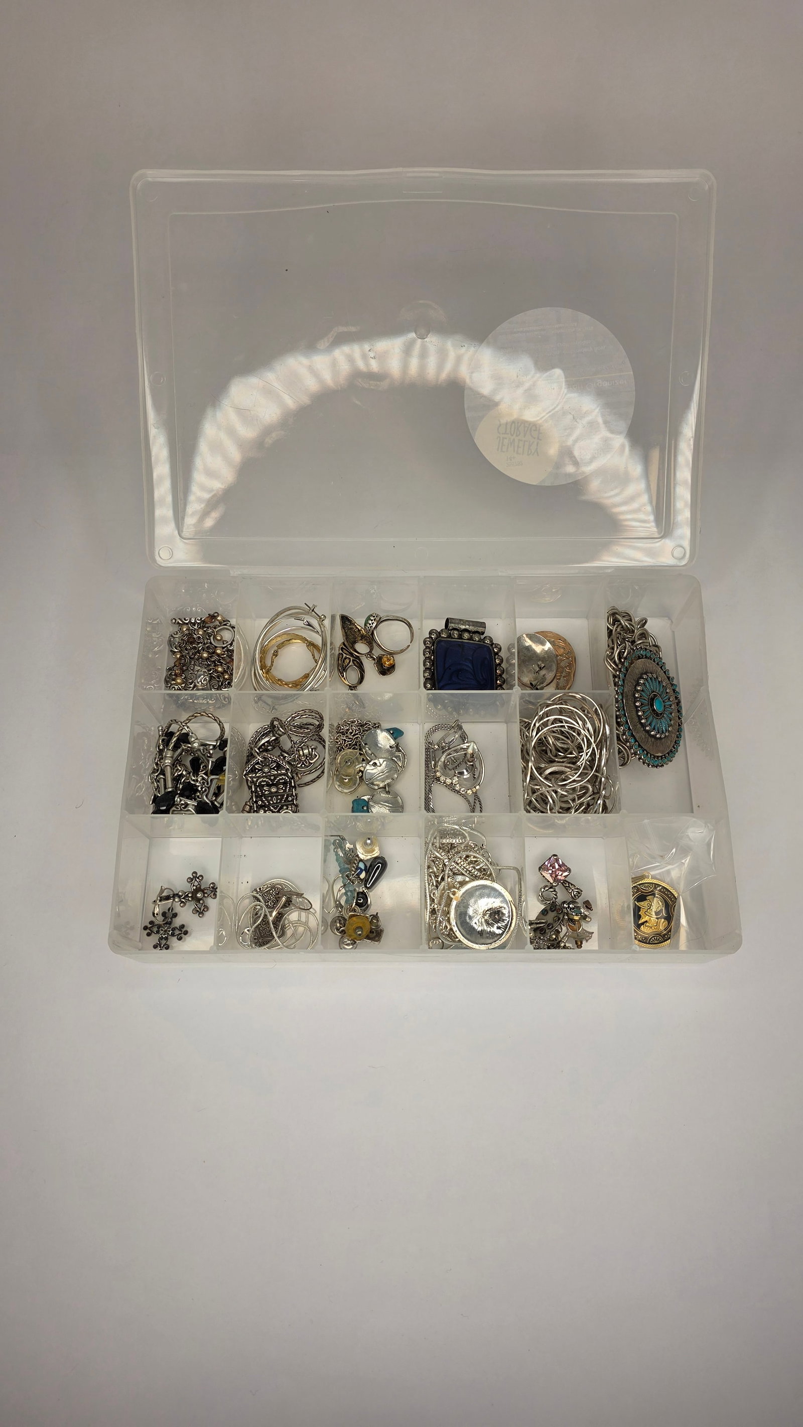 Costume Jewelry #6: Third organizer case containing a variety of earrings, pendants, chains, and charms. Rich mix of silver-tone pieces, ideal for collectors or assemblage artists. Dimensions 11x8x2