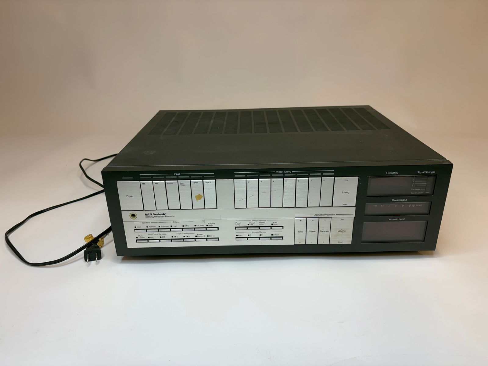 MCS Series A 3285 Synthesizer Reciever - Powers On: Black metal receiver with a silver front control panel featuring multiple rectangular push buttons, labeled sliders, and small toggle switches. Three rectangular display windows on the right side are