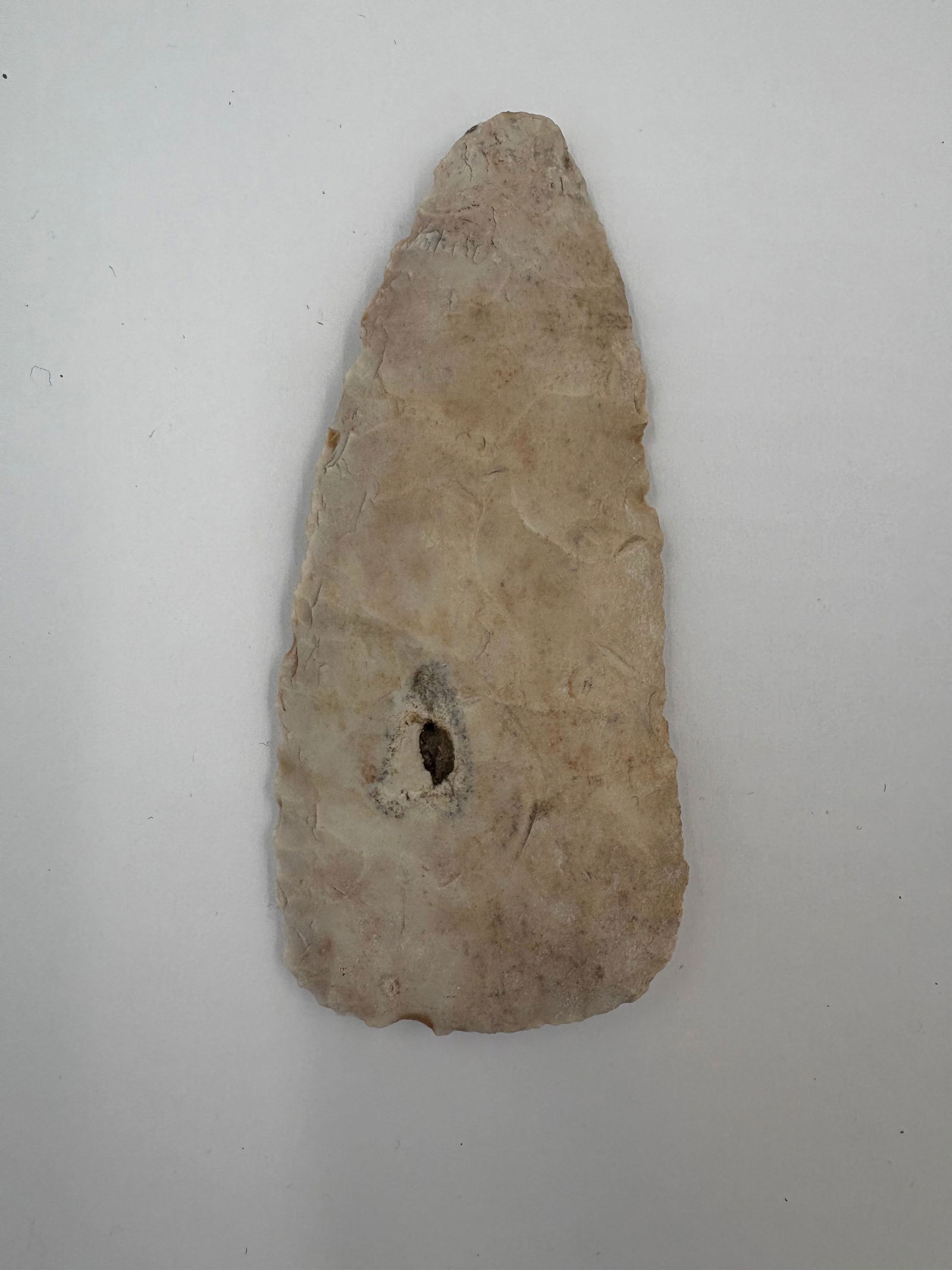 Stanfield Blade - 3 7/8in: Stanfield-style lanceolate blade, 3 7/8-inch length, fashioned from Burlington chert in cream-to-tan tones with areas of orange-brown staining. Both faces exhibit pronounced flake scars and marginal