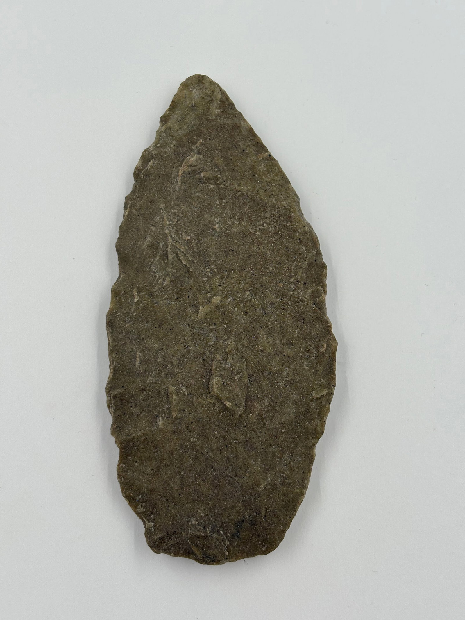 Hixton Blade, sugar-quartz: Hixton-style sugar-quartz blade measuring 4 3/4 inches. Leaf-shaped, bifacially flaked piece with a pointed tip and brown-gray granular surface showing multiple flake scars and slightly convex edges.