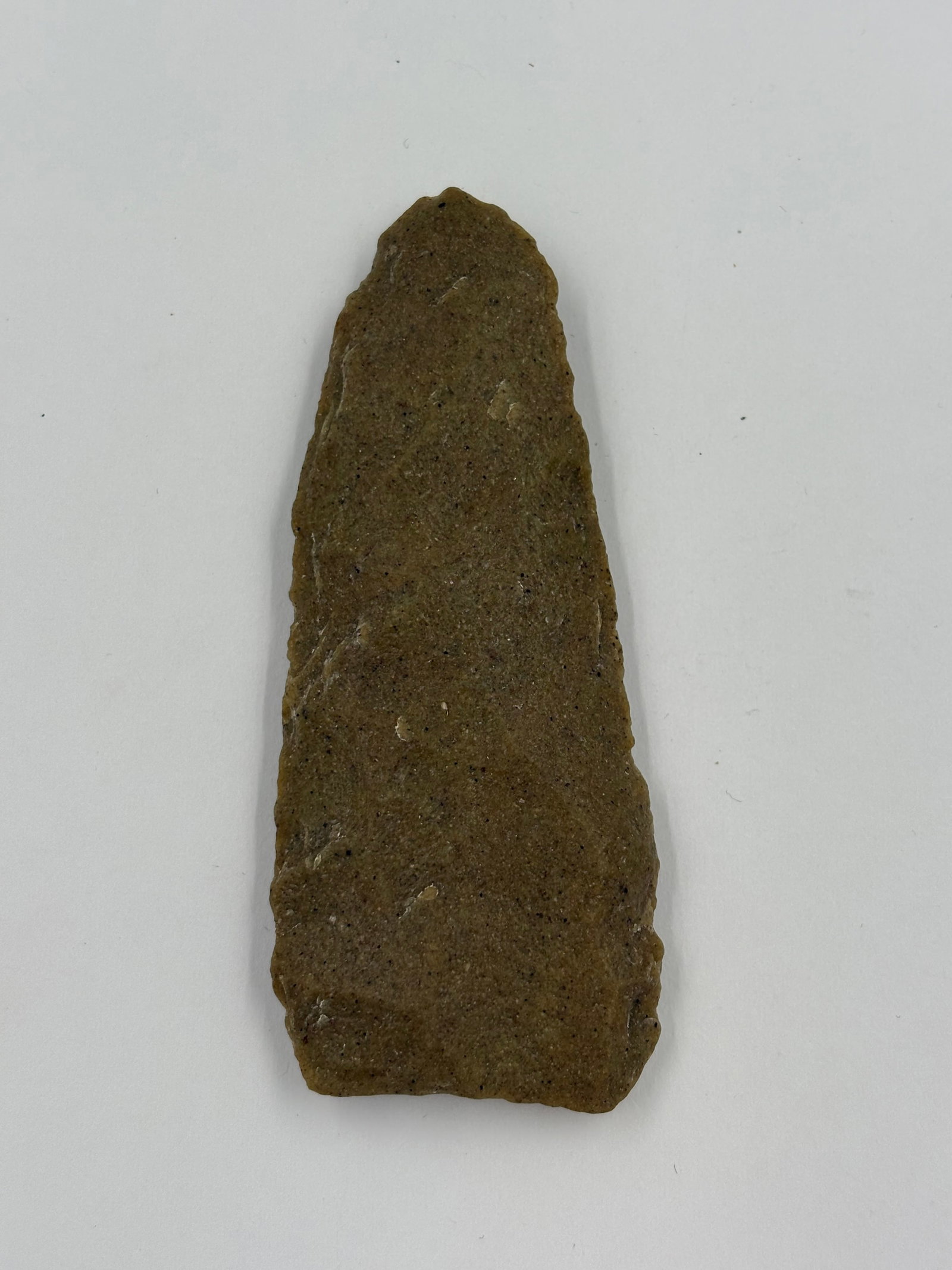 Hixton Blade, sugar-quartz: Hixton-type blade made from sugar-quartz with a tapered, lanceolate form and a squared basal end. Surfaces are predominantly brown-tan with fine dark speckling and a lighter, whitish patch on one