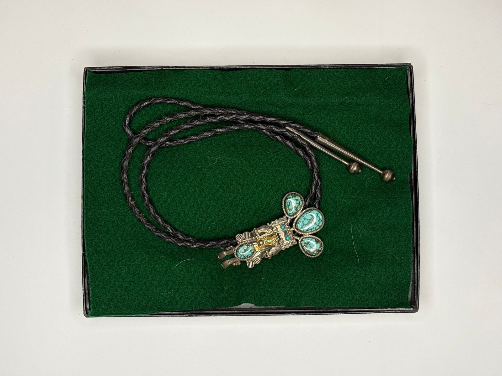1960s Native American Silver and Turquoise Royal Order Jesters Kachina Bolo tie: Vintage 1960s Native American Silver and Turquoise Royal Order Jesters Kachina Bolo tie. The artist is likely Helen Long (Navajo) who made custom high end bolos and other jewelry.This bolo tie is