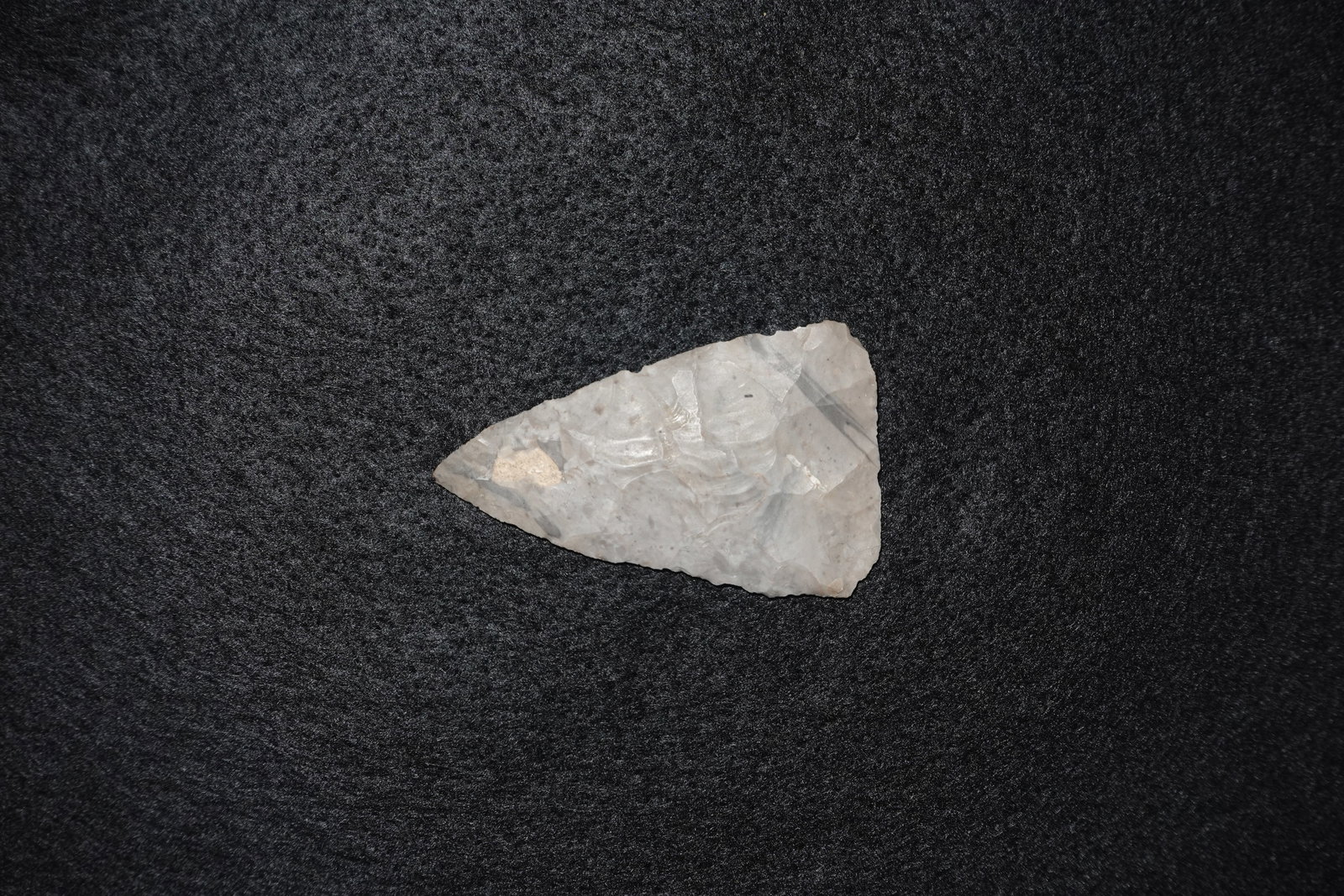 Archaic Blade - Boone Chert: Triangular Boone chert blade with bifacial flaking and well-defined stepped flake scars across both faces. Light gray, translucent chert displays subtle banding and a small tan mineral deposit near