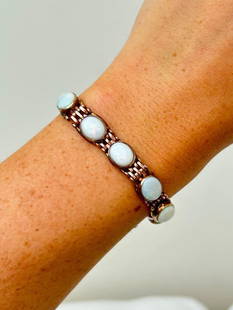 Heavy 9ct gold cabochon opal bracelet with safety chain: Heavy 9ct gold cabochon opal bracelet with safety chain  Such a gorgeous opal bracelet&#160;  measurements&#160; length 17cm width 9mm weight 20.24g  materials 9ct gold and opal