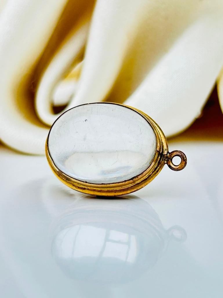 Antique Rock Crystal Pool of Light Domed Opening Pendant: Antique Rock Crystal Pool of Light Domed Opening Pendant a wonderful crystal locket, so precious measurements size 25mm x 17mm weight 8.82g materials r