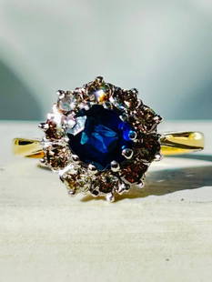 Art Deco Sapphire and Diamond 18 Carat and Platinum Cluster Ring: Art Deco Sapphire and Diamond 18 Carat and Platinum Cluster Ring &#160; The sapphire is a deep blue colour and measures Icarat and the diamonds total approximately 70pts.&#160; &#160; Fully hallmarked