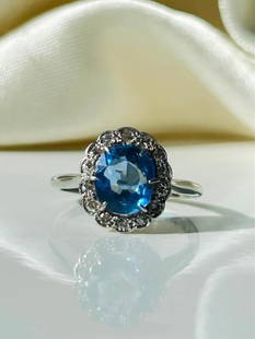 *Vintage Sapphire and Diamond 18 Carat White Gold and Platinum Cluster Ring: Vintage Sapphire and Diamond 18 Carat White Gold and Platinum Cluster Ring &#160; This classic cluster ring holds a central sapphire measuring approx 2ct and diamonds around the edges all set in plati