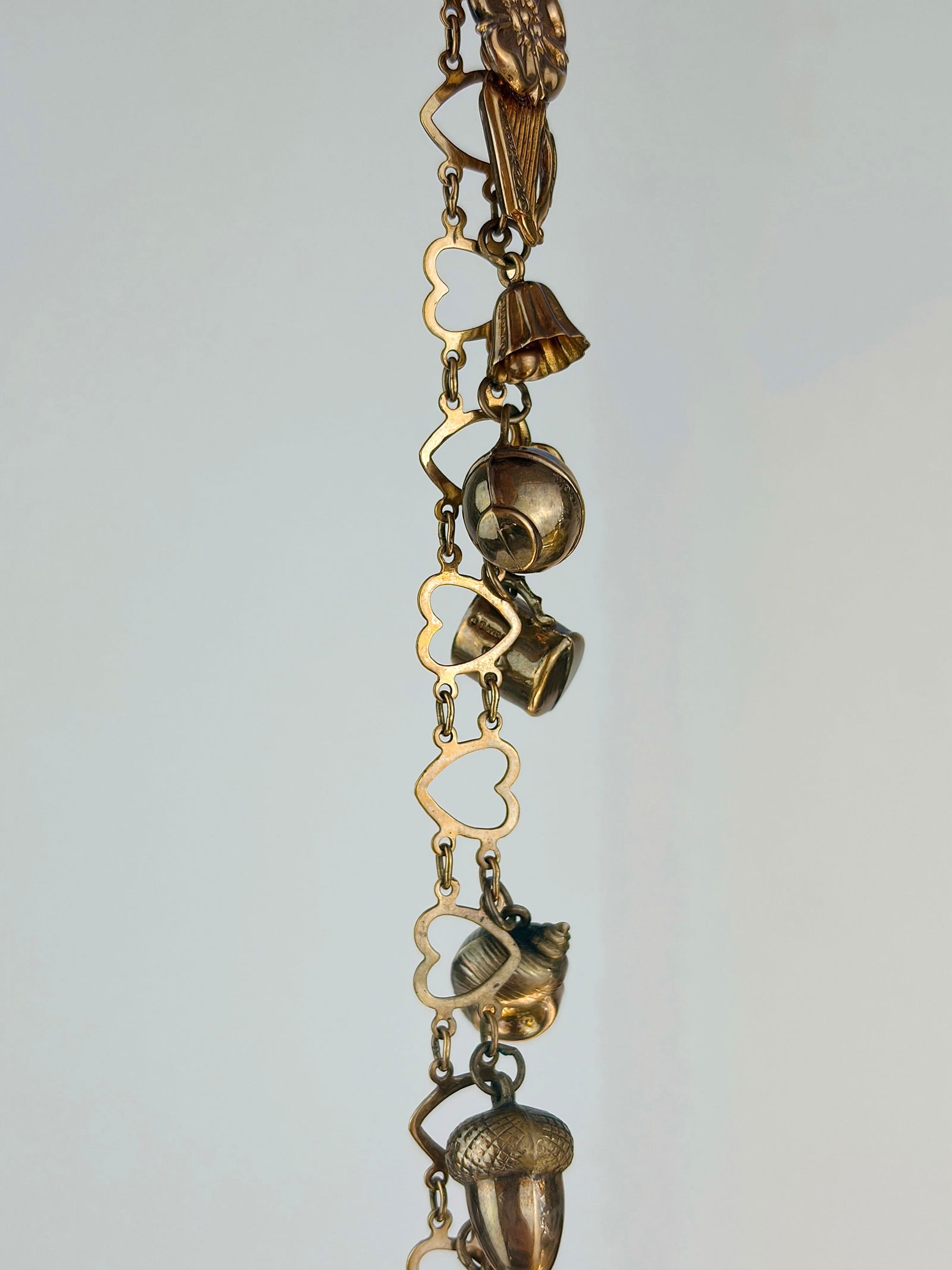 vintage hearts bracelet full of charms all in 9ct gold: vintage hearts bracelet full of charms all in 9ct gold charms include , bell / seashell / acorn / cat / harp / Tudor rose, thimble and more!