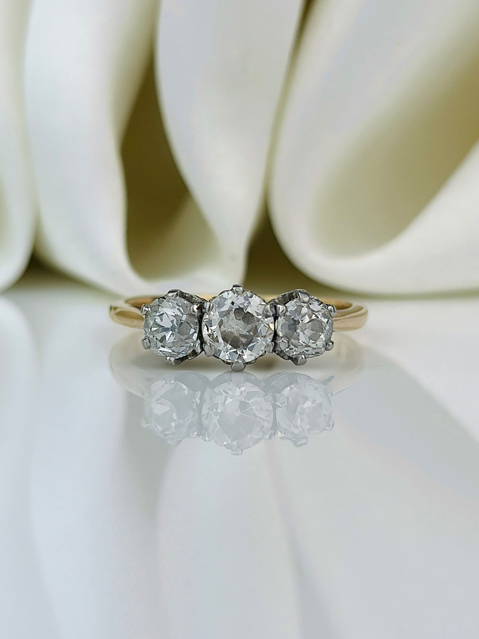 chunky 9ct yellow gold 1.25ct diamond 3 stone ring: chunky 9ct yellow gold 1.25ct diamond 3 stone ring central stone approx .55 pts with two matching .35pts either side 