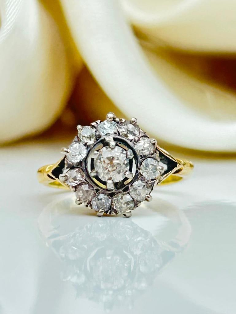 *Victorian Old Mine Cut Diamond and 18 Carat Gold Cluster Ring: Victorian Old Mine Cut Diamond and 18 Carat Gold Cluster Ring This stunning cluster ring holds old mine cut diamonds set within the platinum setting. The central stone measures approx 30