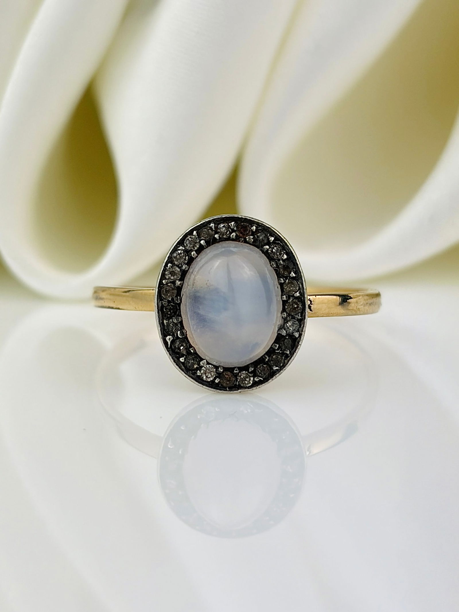 antique yellow gold moonstone and diamond ring: antique yellow gold moonstone and diamond ring An amazing cabochon moonstone surrounded by a beautiful halo of diamonds!