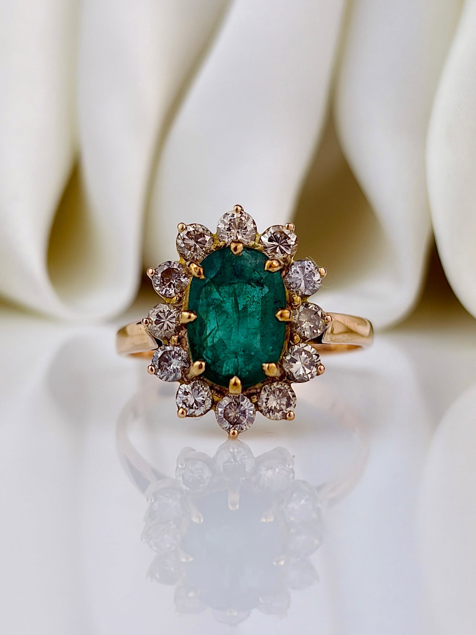 Huge 18ct Yellow Gold Emerald and Diamond Cluster / Flower Ring: Huge 18ct yellow gold emerald and diamond cluster / flower ring The most incredible cluster ring with a deep green emerald surrounded by a halo of sparkling diamonds!