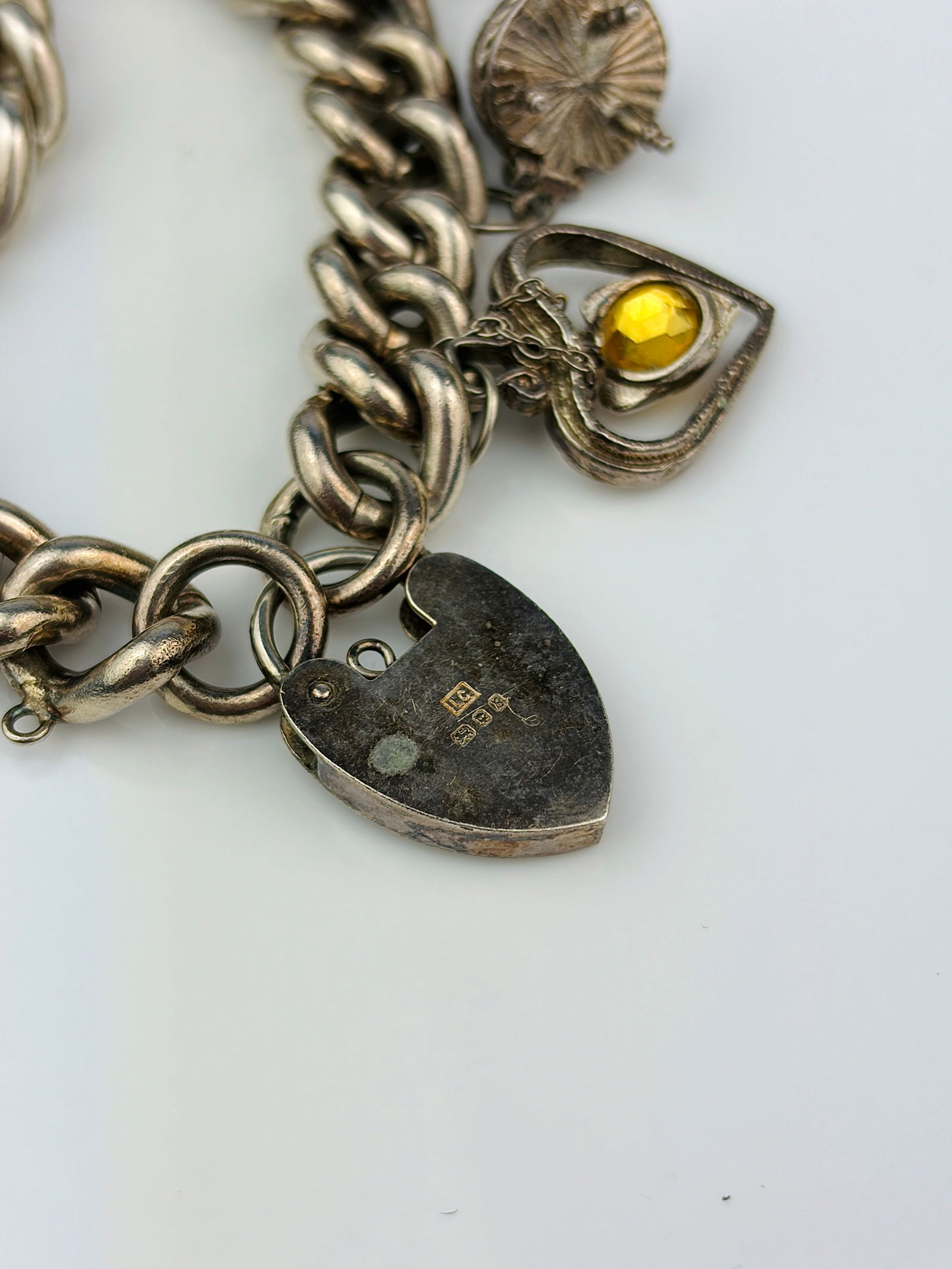 heavy silver charm bracelet with rare opening charms. - very heavy - 6