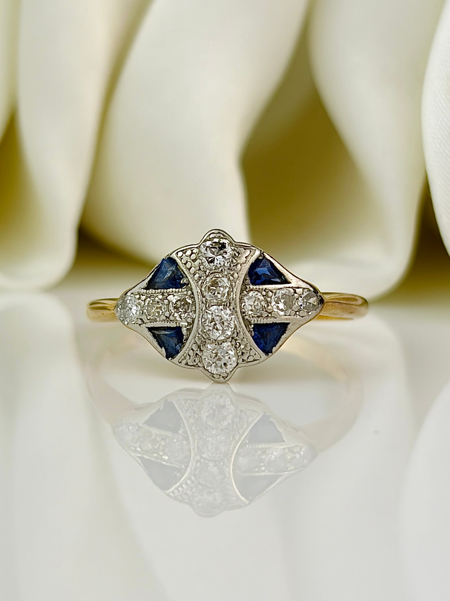 Sweet Art Deco Sapphire and Diamond 18 Carat Gold and Platinum Ring: Sweet Art Deco Sapphire and Diamond 18 Carat Gold and Platinum Ring This ring is gorgeous and holds an inky blue sapphires and a sparkling diamond. The sapphires measure approx 10pts each and the